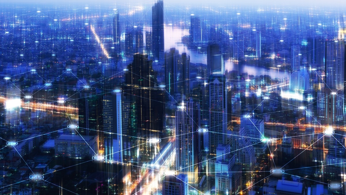 Smart City network connection points in the sky over a city landscape
