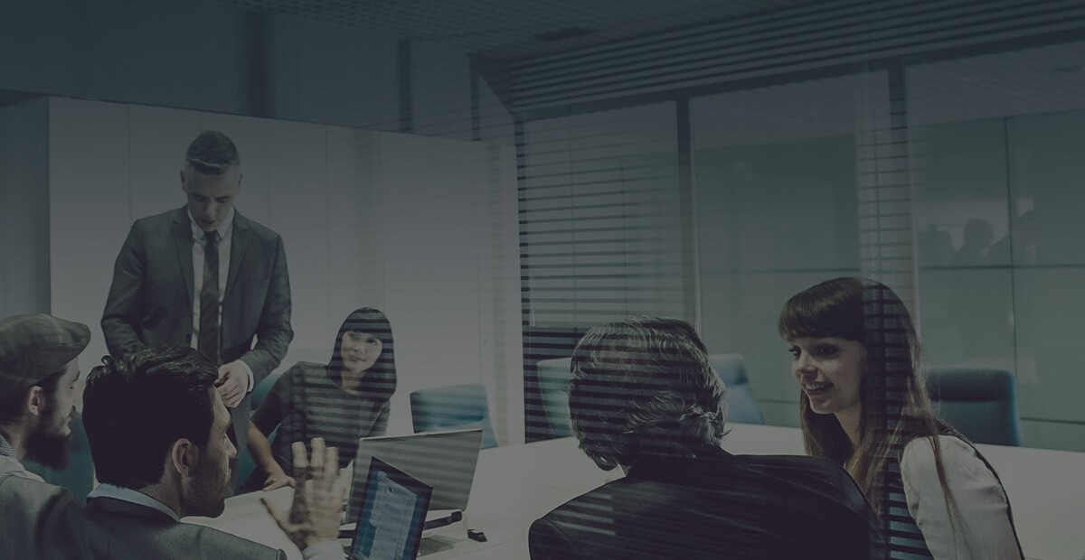 Board meeting setting with people around a table