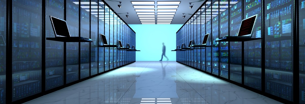 Perspective view of a datacenter server corridor with a person walking in the distance